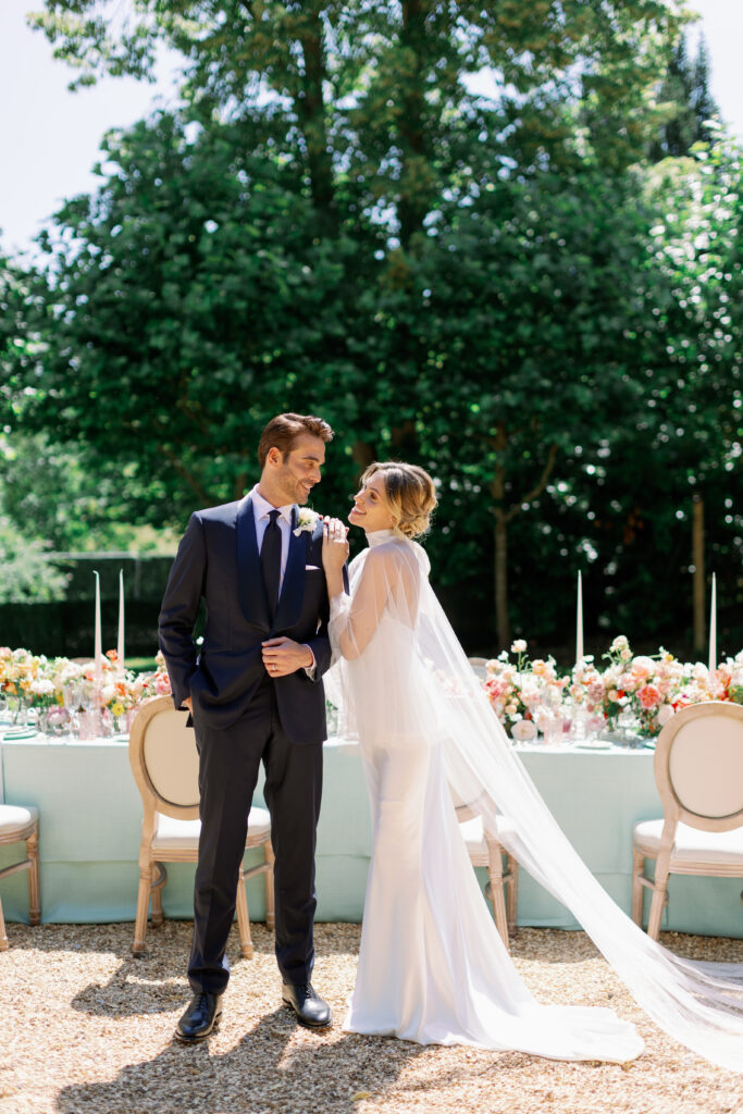 Mrs T Weddings at Waddesdon. Elle wears 29 Atelier silk slip dress and cape. Sergio wears custom made suit from Nicholas & Harding and shoes from Loake Shoemakers.